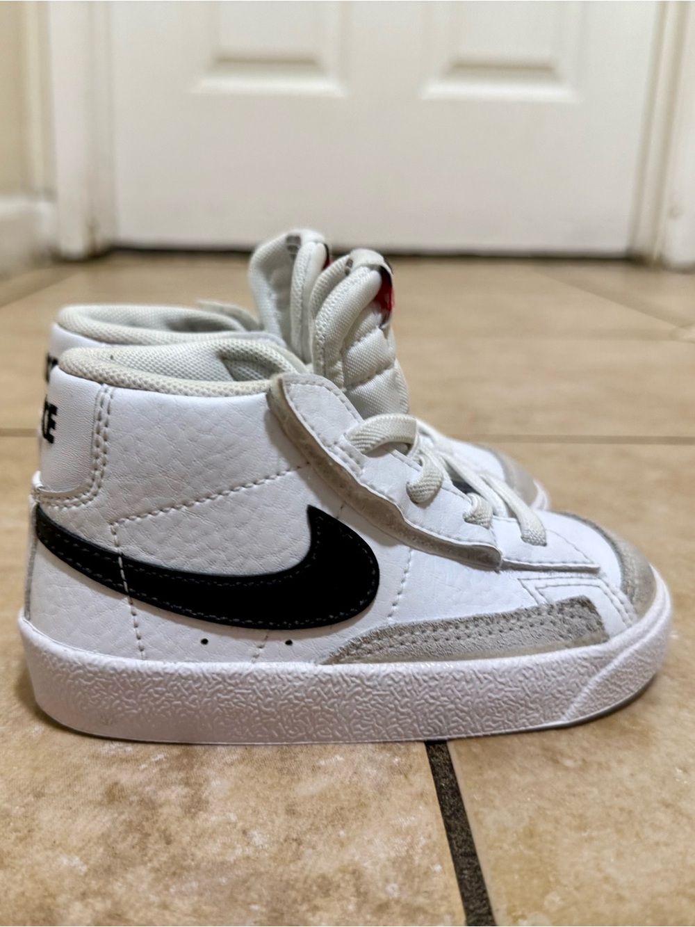 Nike Kids White High-Top Sneakers with Black Swoosh